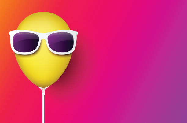 istock Pink background with yellow balloon in sunglasses. 968898712