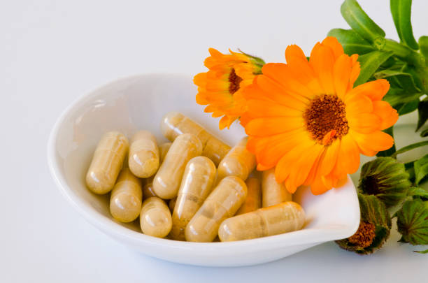 istock Alternative Medicine. Homeopathy. Calendula capsules. 968902168