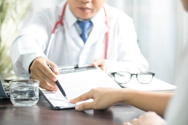 Doctor introduces patient signing on medical records before treat illness in hospital Doctor introduces patient signing on medical records before treat illness in hospitalmm, healthy concept demobilization photos stock pictures, royalty-free photos & images