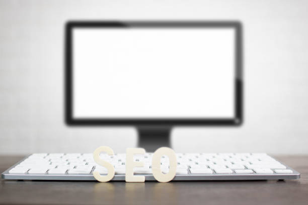 istock Search Engine Optimization concept, wood of SEO on keyboard in front of computer 968907584