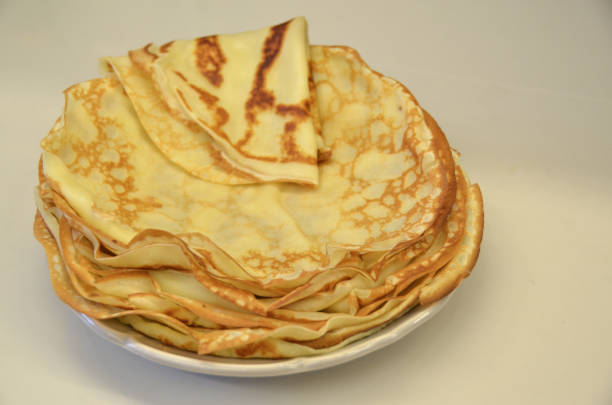istock Blini. Tasty Russian pancakes on white table. Close up 968910562