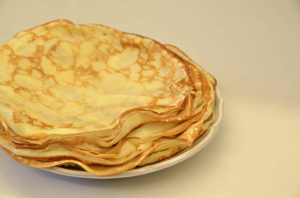 istock Blini. Tasty Russian pancakes on white table. Close up 968910588
