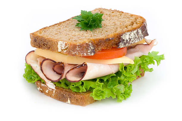 istock A ham sandwich with lettuce and tomato on wheat bread 96891088