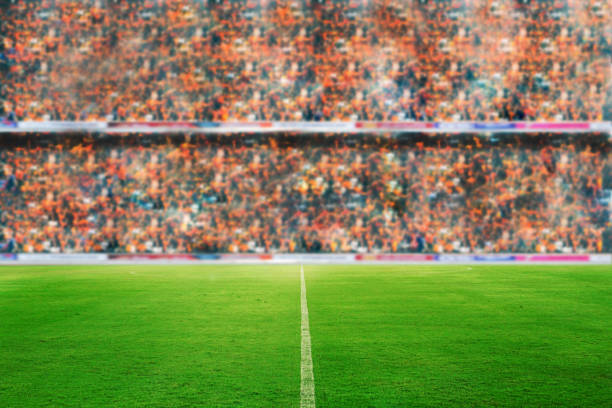 blurry of Soccer fans in a match and Spectators at football stadium stock photo