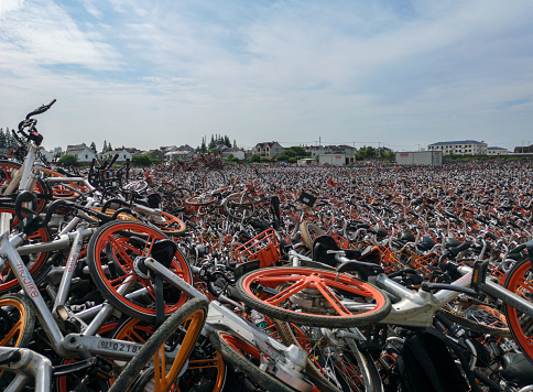 Shanghai,China-June 3,2018: Plethora of shared bikes parking lot at shanghai city.