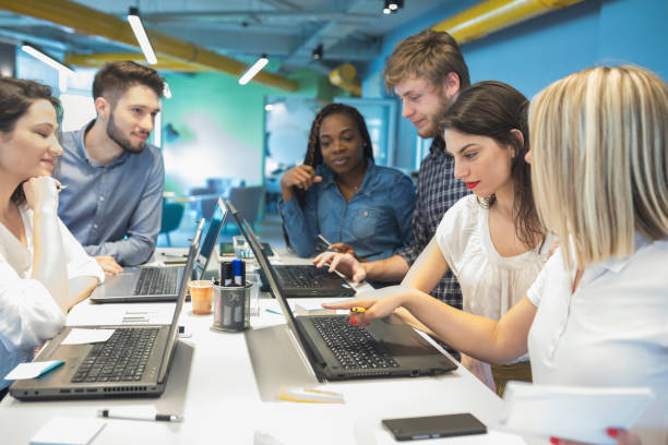 istock Young coworkers in modern office 968917550