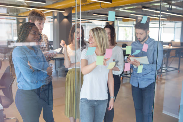 istock Young coworkers in modern office 968921034