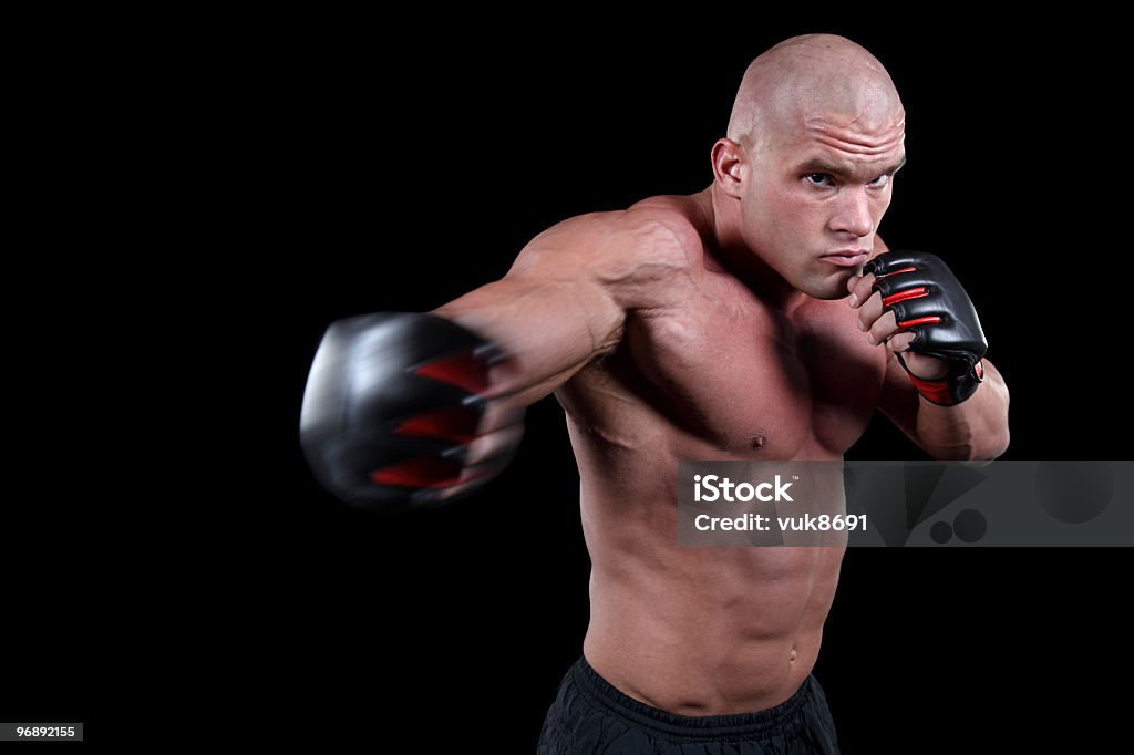 Muscles en action Pratiquant de combat libre - Photo de Adulte libre de droits