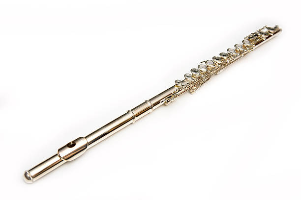 A single flute laying on a white background  stock photo