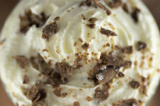 istock Creamy chocolate dessert drink ice cream mousse with whipped cream in studio with macro lens 968924148