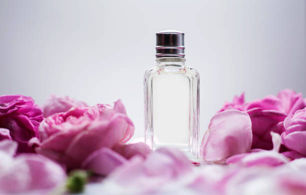 istock Female perfume with pink flowers 968924834