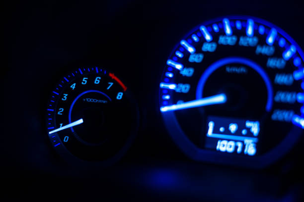 istock Closeup dashboard of mileage car with light blue 968925470