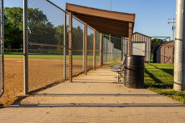 istock players bench at a municipal softball field 968925900