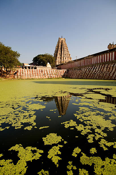 India. Hampi. Hinduist a temple and Ancient water pool stock photo