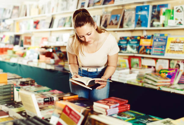 istock Woman buying textbooks 968928584