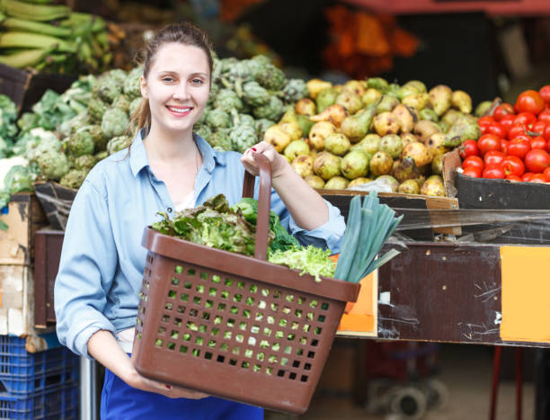 istock Woman is choosing vagetables with basket 968929124