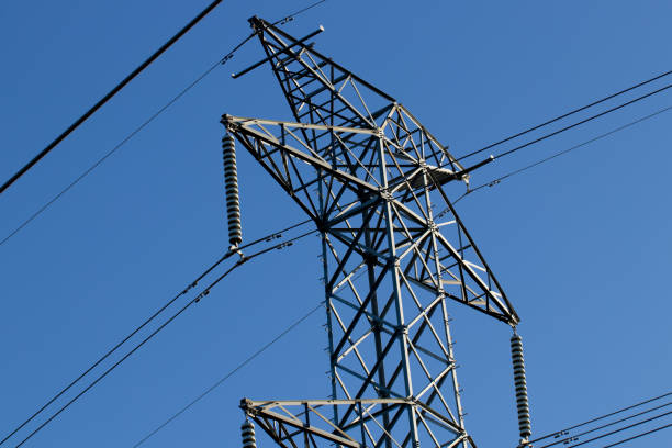 istock Industrial electricity tower wires with blue sky 968932048