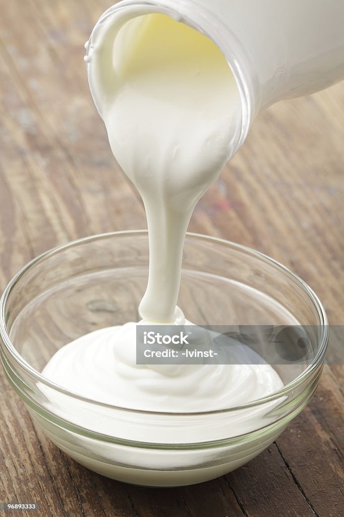 Pouring sour cream  Pouring Stock Photo