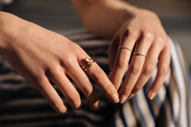 crop woman hands with rings on the street - jeweleries imagens e fotografias de stock