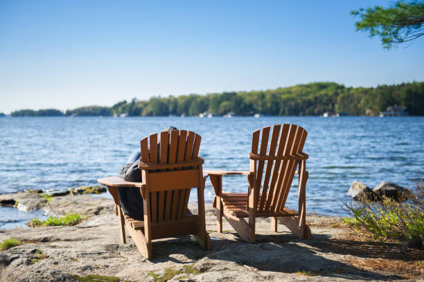 istock Muskoka chairs on a rock formation 968936434