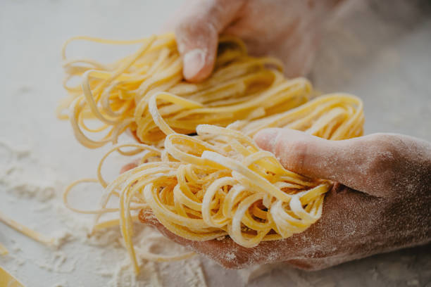 istock Chef making traditional italian homemade pasta 968940130