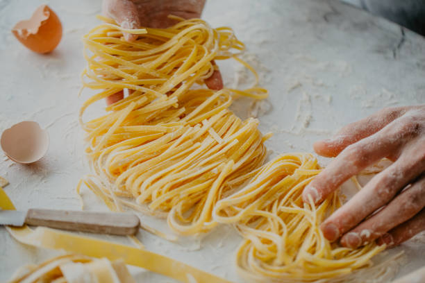 istock Chef making traditional italian homemade pasta 968940168