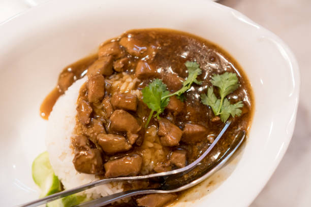 istock Stew beef with Rice in white dish 968943460