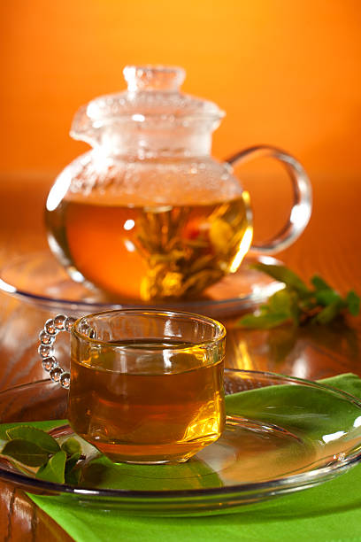 istock Glass of greean tea and teapot 96894353