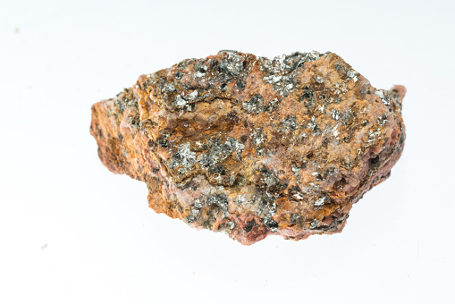 mica schist mineral sample studio shot with white background