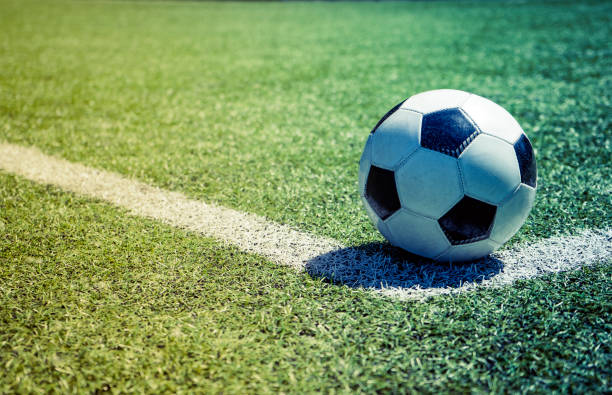 istock Old soccer ball on the grass 968944874