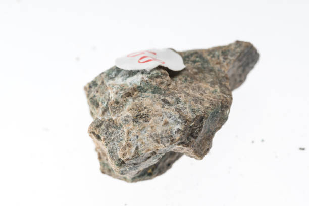 istock epidote skarn mineral sample studio shot with white background 968949002