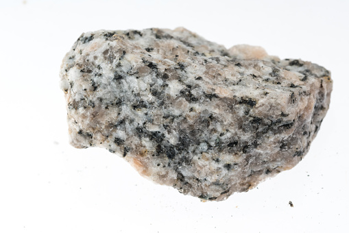 granite gneiss mineral sample studio shot with white background