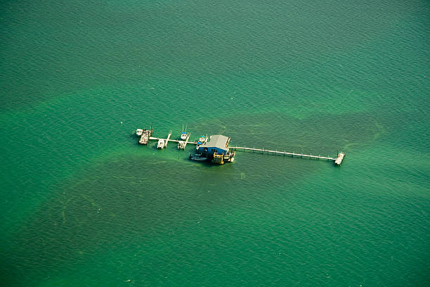 istock Stilt houses and pier in the ocean 96895501