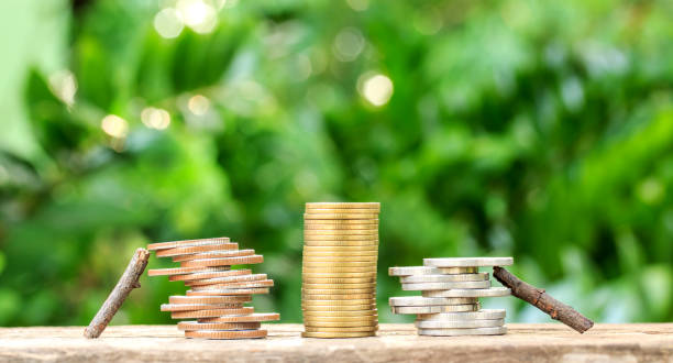istock Wood helped coin. and coin stack.Help concept 968956144