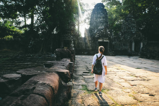 istock Woman with backpack exploring Angkor in Cambodia 968960890