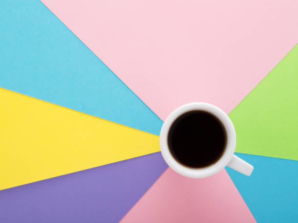istock Coffee espresso in white cap on pastel coloured creative background. 968961058