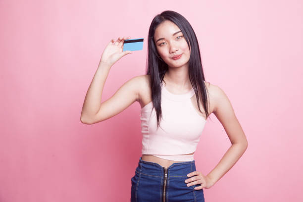 istock Young Asian woman with a blank card. 968961752