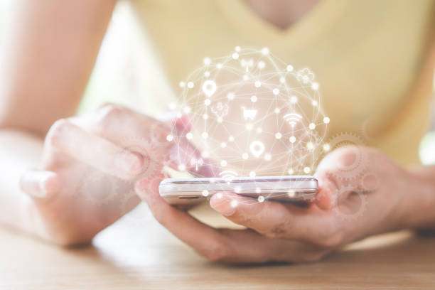 istock woman hand holding smart phone with digital technology global network  icons 968961928
