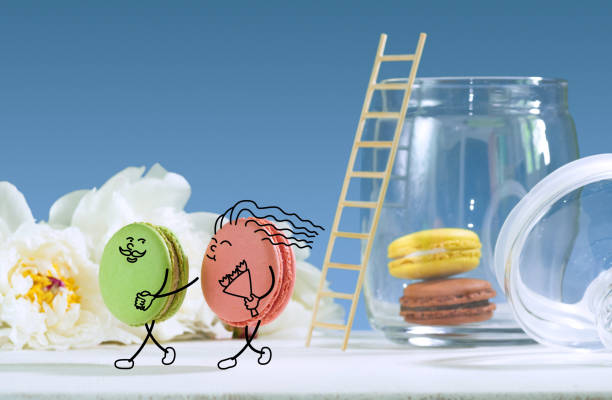 istock Funny macarons are portraying couple in love. 968964302