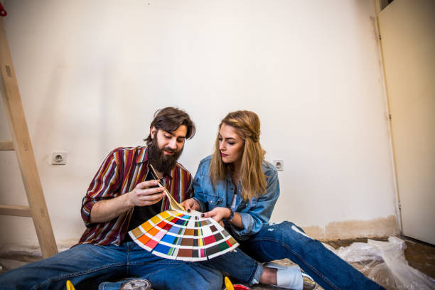 istock Hipster couple enjoying renovating their house 968966086