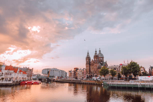 istock sunrise over the train station of Amsterdam 968968170