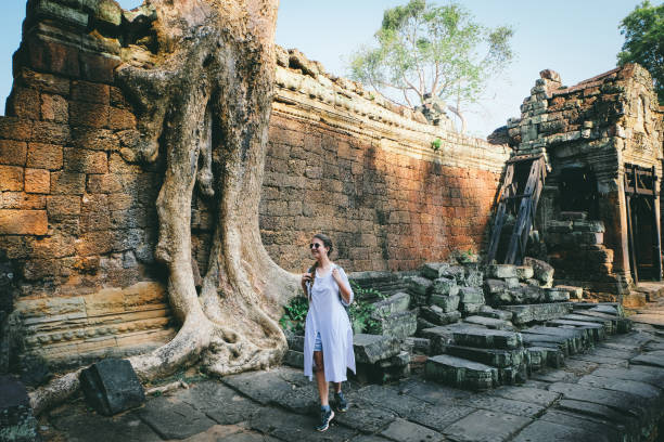 istock Woman with backpack exploring Angkor in Cambodia 968968780