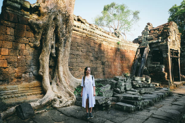 istock Woman with backpack exploring Angkor in Cambodia 968968920