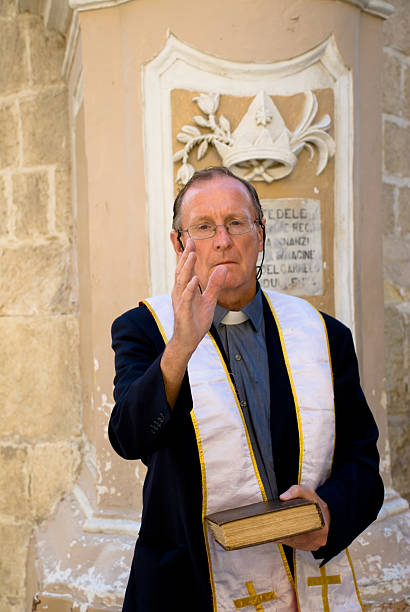 istock Priest with Bible gives a blessing 96898056