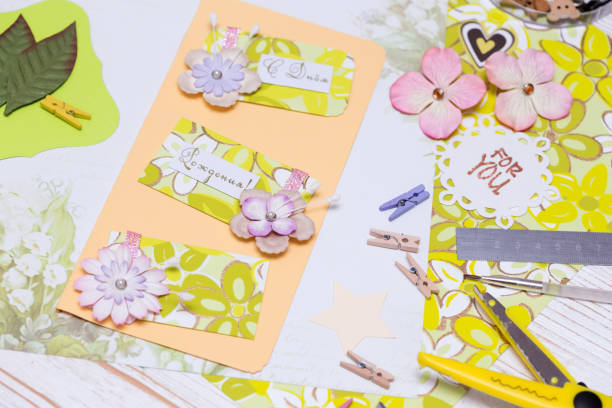 istock scrapbook background. process of creating a postcard - Card and tools with decoration 968980570