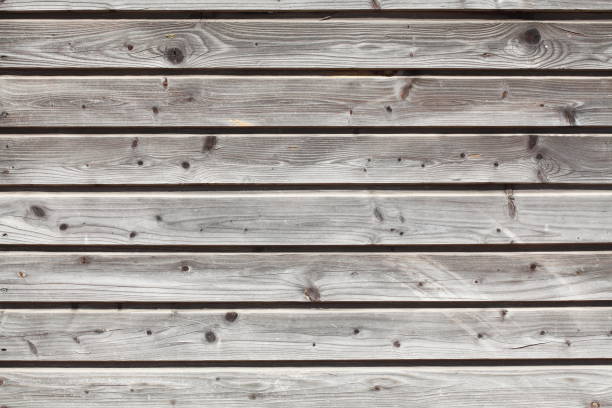 istock Grey wooden wall on a construction fence, wood texture 968984162