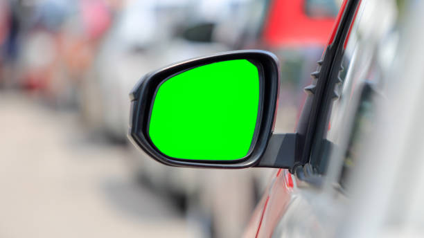 istock green screen , side view mirror car in rush hour traffic 968984176