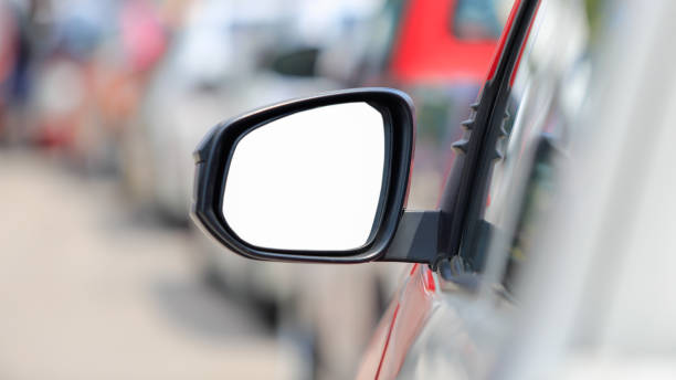istock white background , side view mirror car in rush hour traffic 968984204