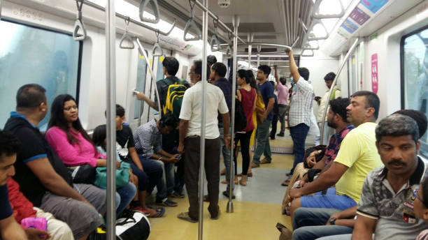 Mumbai Metro train running and commuters sitting & standing in the metro. Comfortable, modern , fast, new & air conditioned way of transport in Mumbai India MUMBAI, INDIA - MAY 28, 2018 - commuters traveling in Mumbai Metro train local transport Mumbai, Maharashtra, India, Southeast Asia train air conditioner stock pictures, royalty-free photos & images