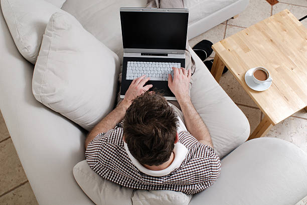 istock Young man working at home on a laptop 96899411